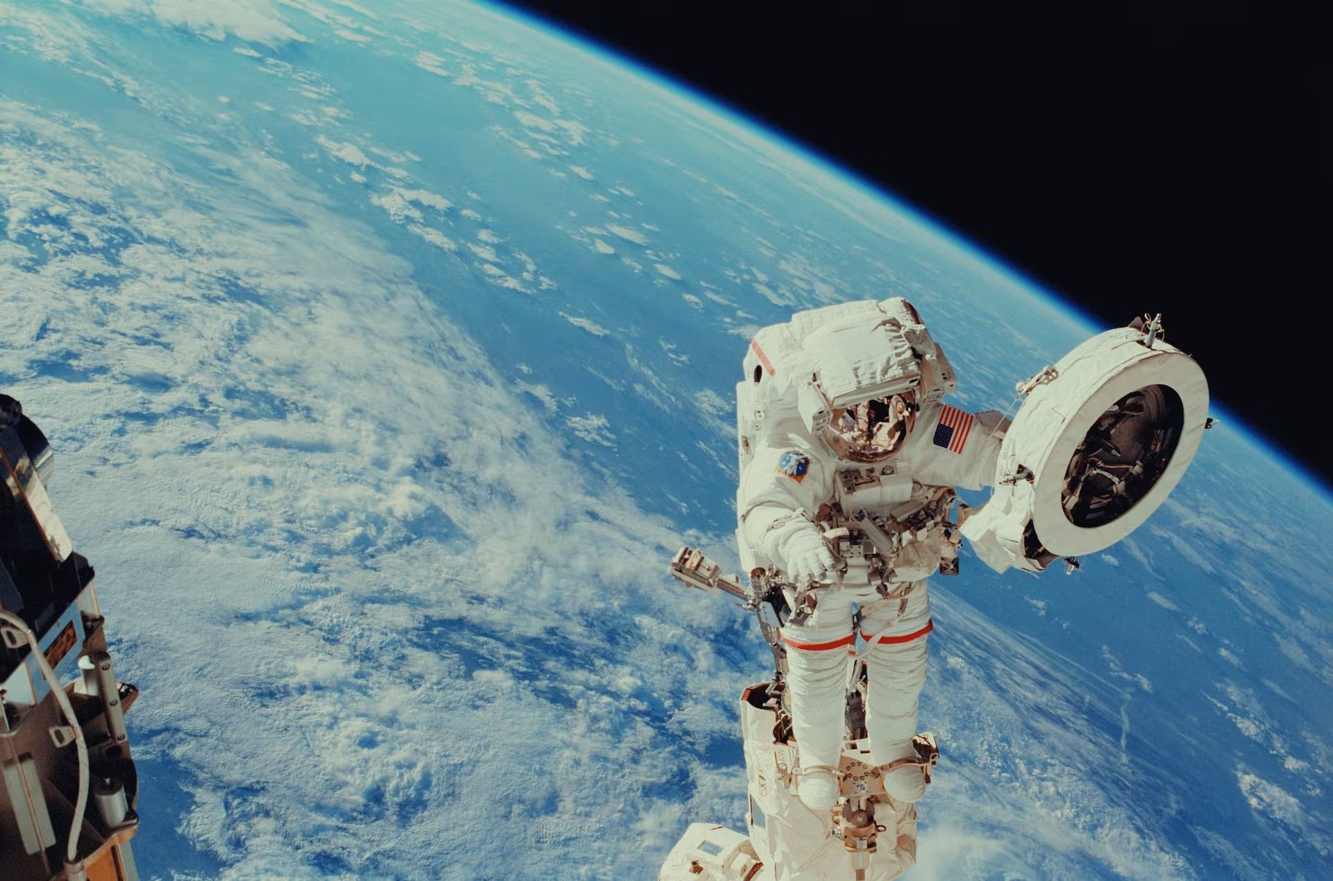 Background image of Earth and astronaut